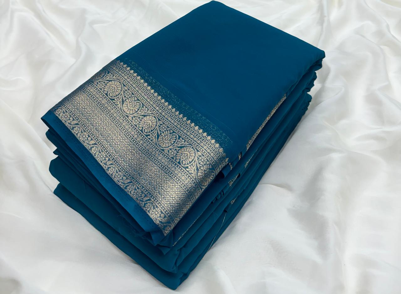 Peacock Blue Pure Khadi Georgette Saree with Silver Contrast Border